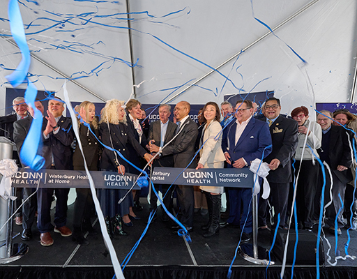 Deborah Weymouth, President, UConn Health Waterbury Hospital, and Governor Ned Lamont cut a ribbon to celebrate Waterbury Hospital joining UConn Health and the creation of the UConn Health Community Network
