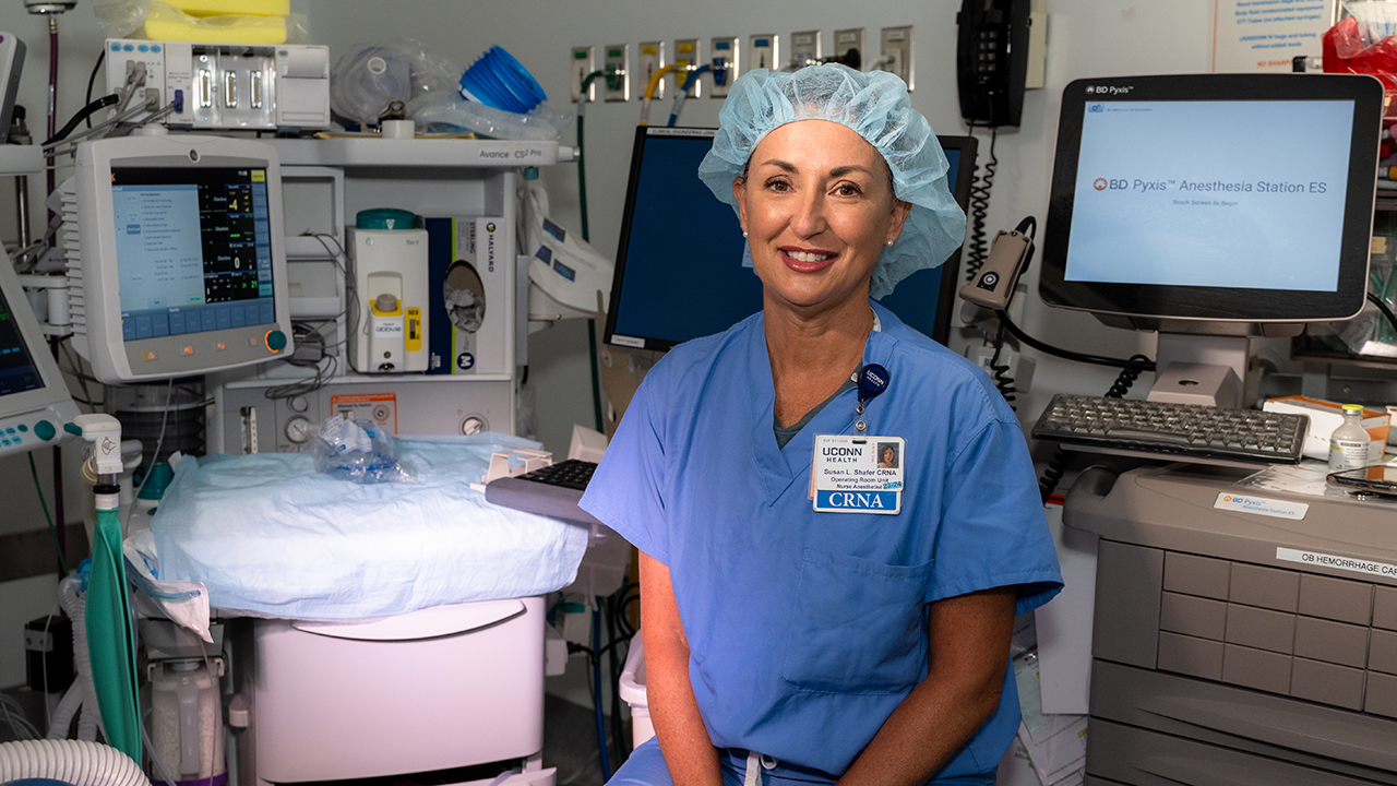 Susan Shafer, CRNA, a certified nurse anesthetist, sitting in a patient exam room