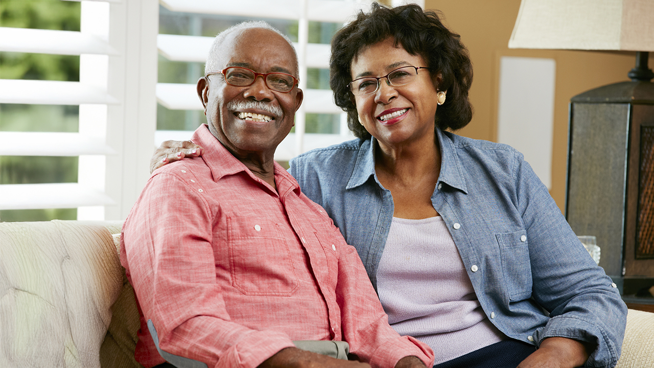 Older African American couple smiling