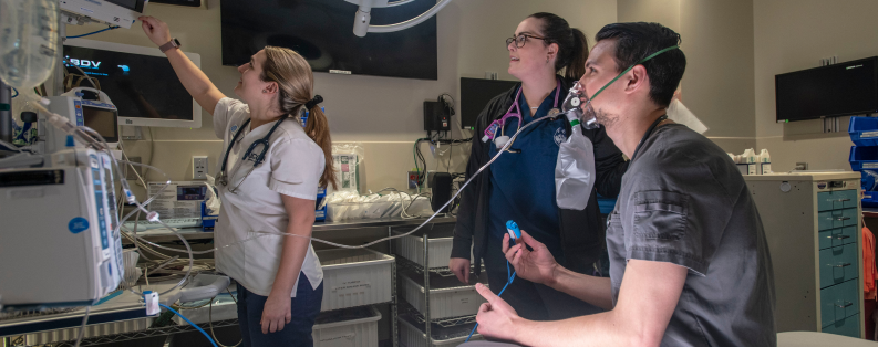 Patient and two technicians conducting test