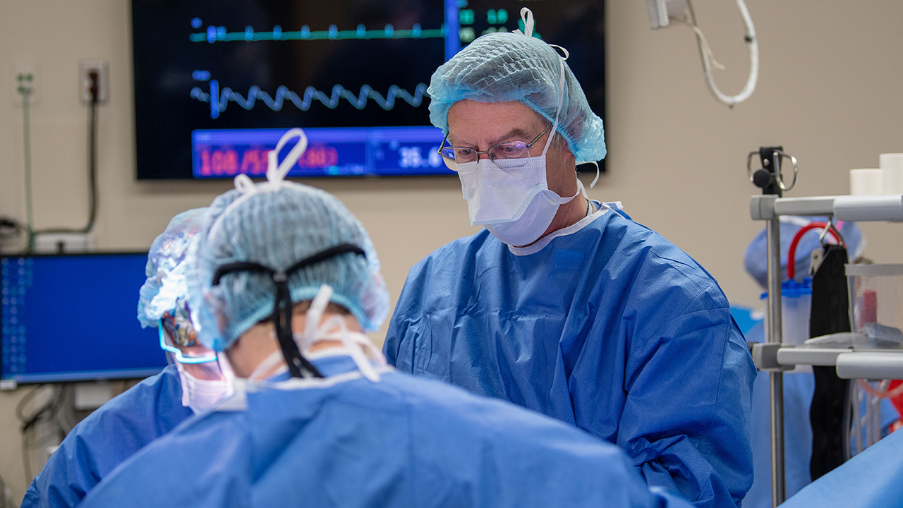Dr. Peter Albertsen performing surgery in the operating room