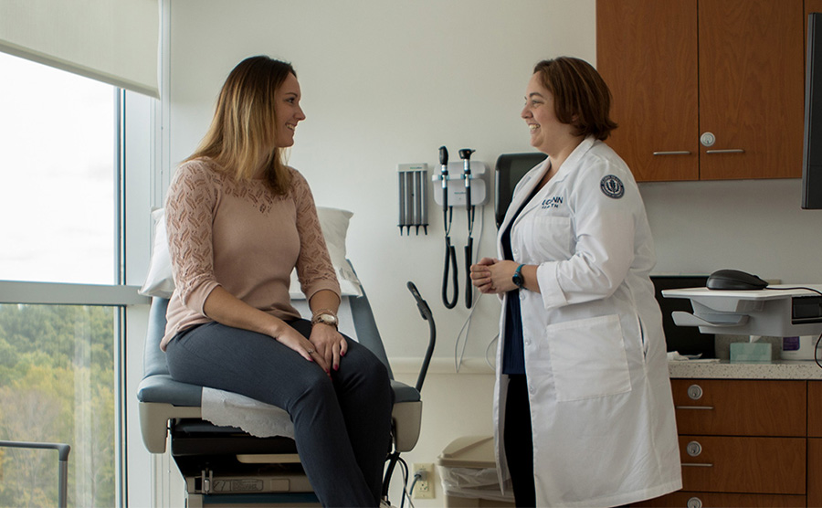 Woman talking to OBGYN