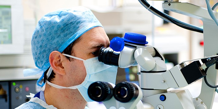 Surgeon performing eye surgery