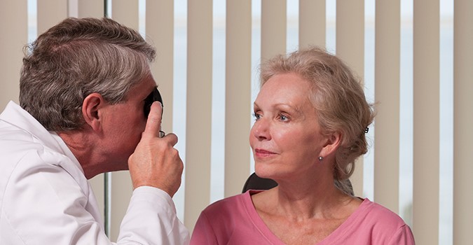 Ophthalmologist performing an eye exam