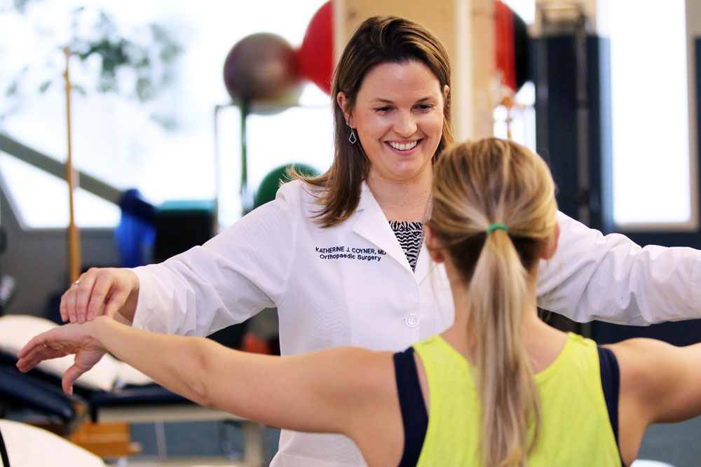 physical therapist and patient