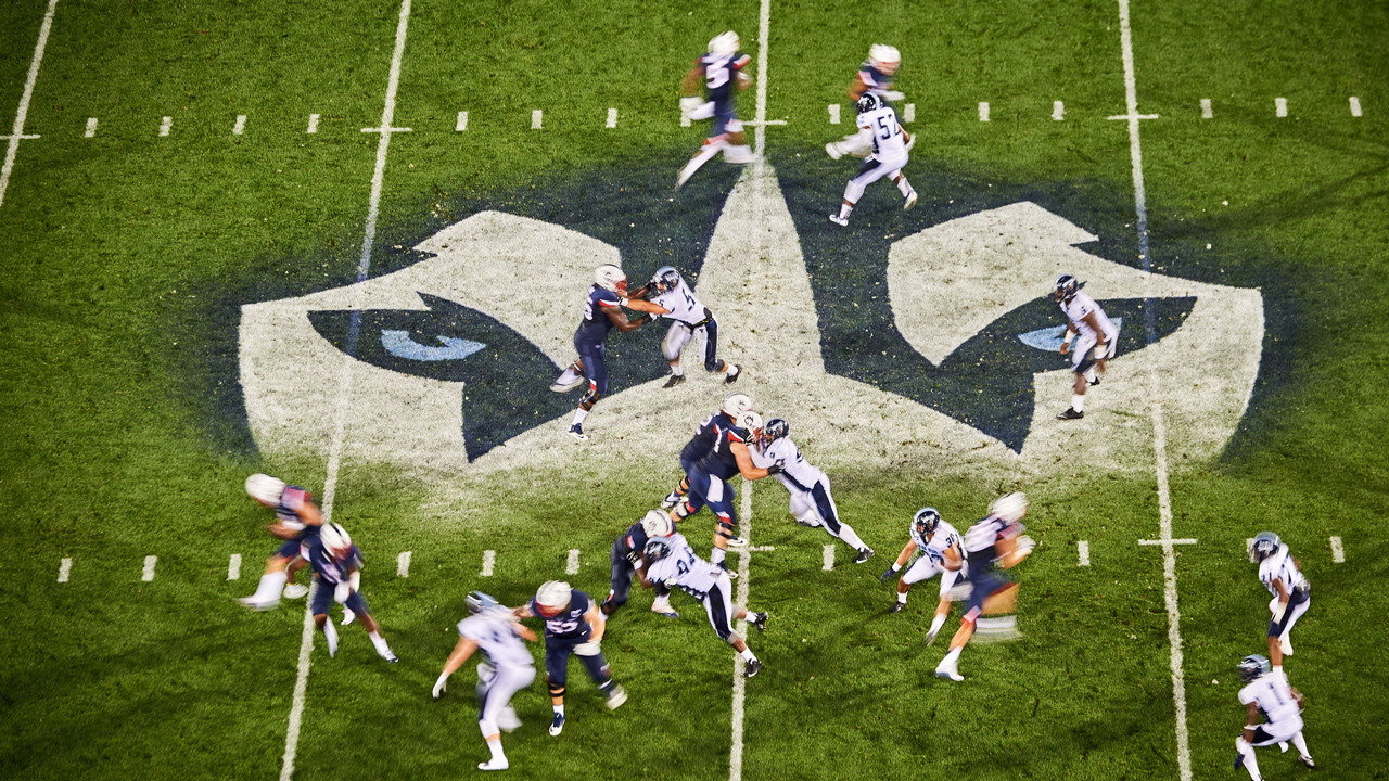 Football field with a play in progress