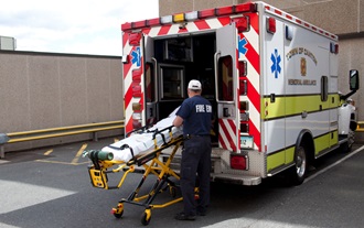 EMS with patient in a gurney