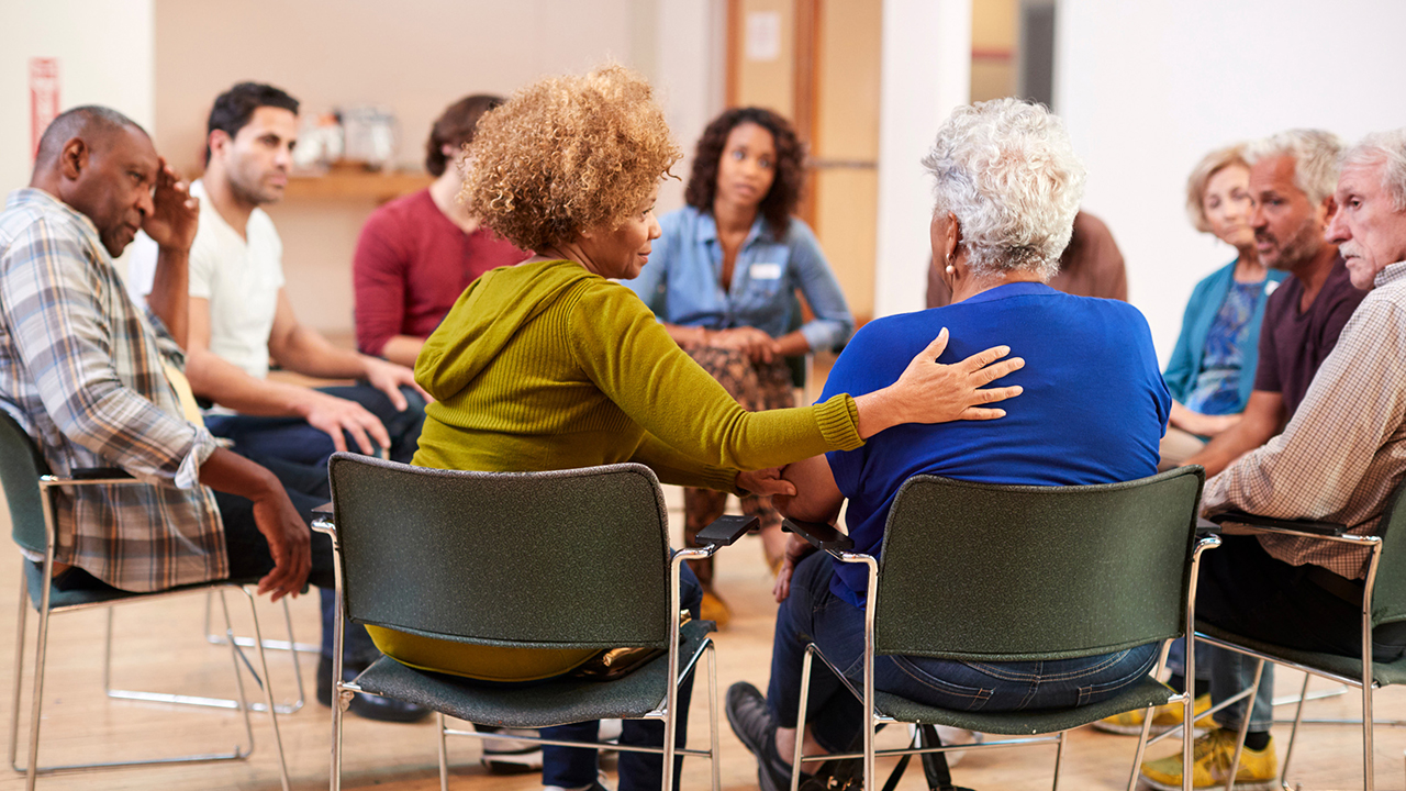 Group of adults sitting in a circle