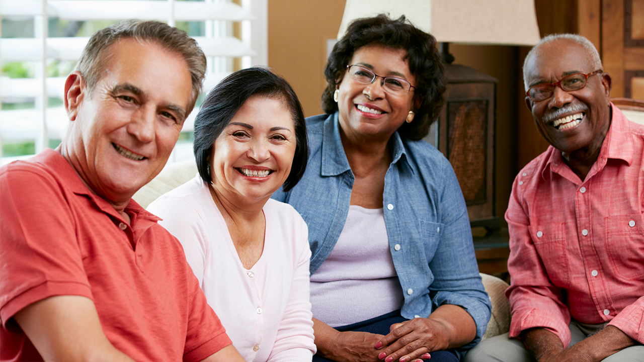 A group of senior friends at home together